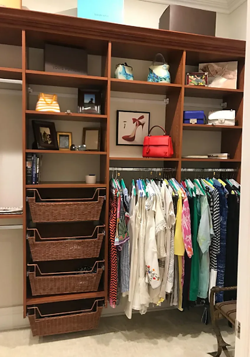 A neatly organized walk-in closet after a Sunbrite Cleaning LLC service